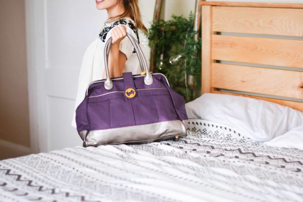 travel bags for women, available in purple, gray, and olive green