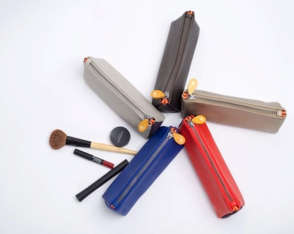 zipper makeup pouch and cosmetics bag in blue, gray, black metallic, red, and gold