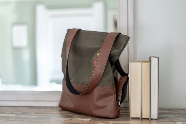 olive green canvas tote and backpack