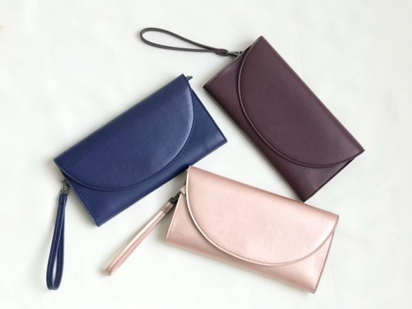 women's wristlet wallet in navy, rose gold, and burgundy