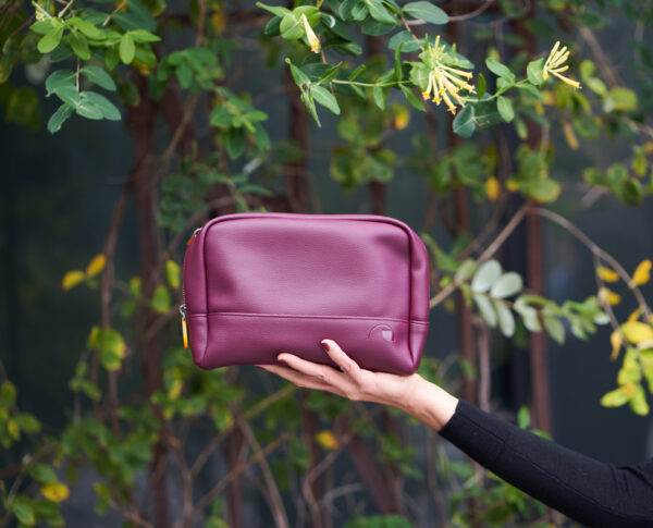 burgundy makeup and cosmetics bag with double zipper and interior pockets