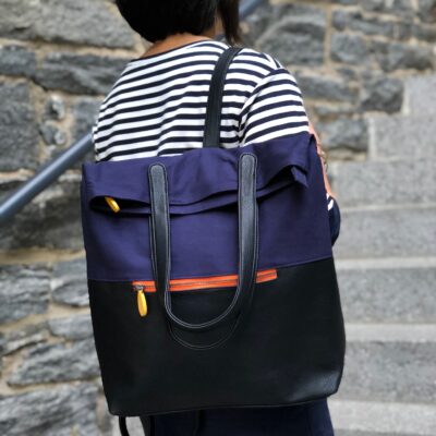 navy and black convertible vegan backpack with water bottle pocket