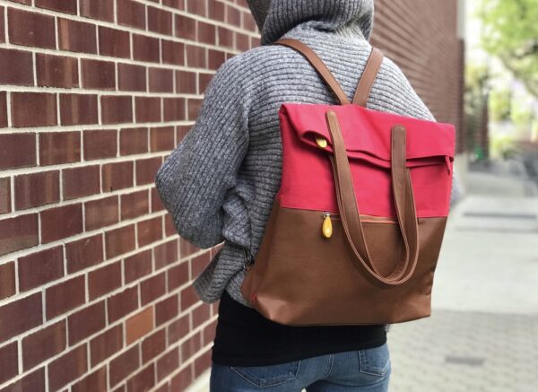 red and brown vegan leather backpack with water bottle pocket